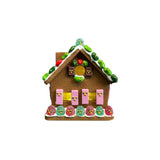 mini gingerbreadby house plastic sculpture